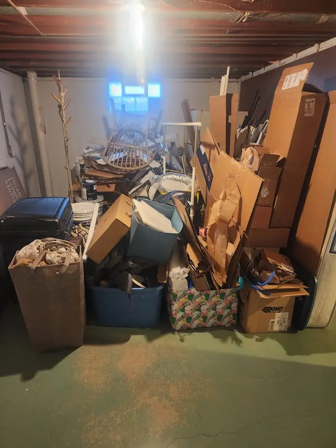 Roll-off dumpster container at job site for Construction Dumpster Rental in Wales